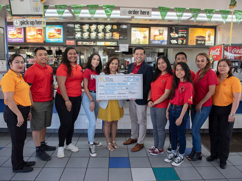 McDonald’s of Saipan is offering a $5,000 hole-in-one prize that will be featured at the upcoming annual NMC Foundation Golf Tournament on Saturday, March 20, 2021. In this pre-pandemic photo are McDonald’s executive assistant to the president, Mable Ayuyu-Glenn, center, Northern Marianas College Interim President Frankie Eliptico, Rutzel Perez, acting general manager of McDonald’s Garapan, Jocelyn Asistores, general manager of McDonald’s Middle Road, and NMC students.
