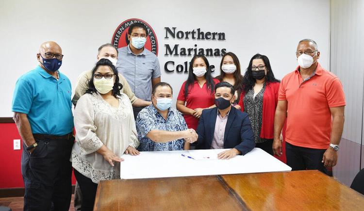 From left, CNMI Board of Education Vice Chairman Herman M. Atalig, outgoing Chairwoman Janice Tenorio, BOE members Andrew Orsini and Antonio Borja, Commissioner of Education Alfred Ada, NMC Regent Irene T. Torres, NMC Interim President Frankie Eliptico, NMC Regents Michelle Lin Sablan and Zenie Mafnas, and NMC Board Chairman Charles Cepeda.