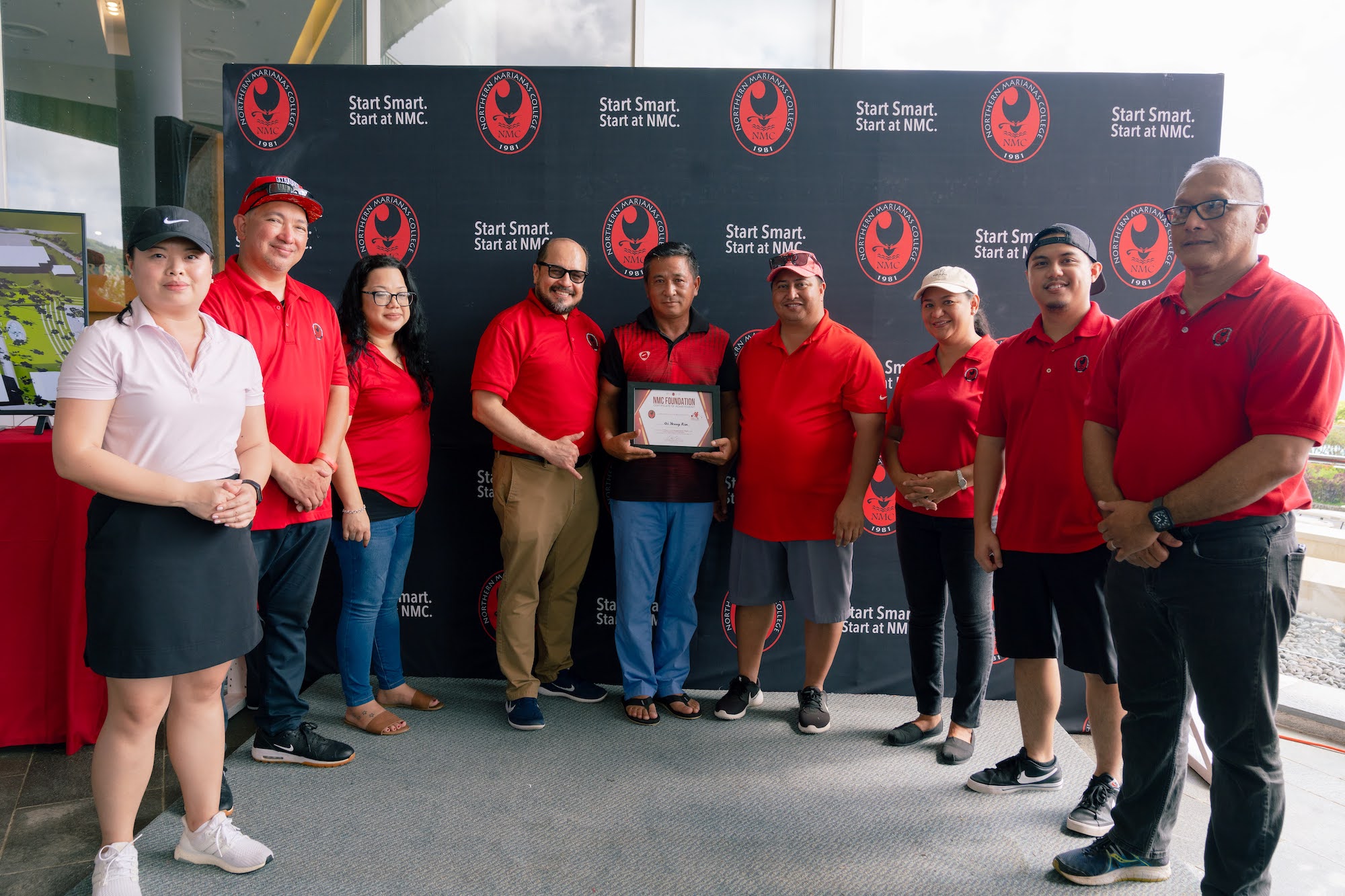 Gi Yeong Kim, center and the Championship Flight winner of the 17th Annual NMC Foundation Golf Tournament, poses with, from left. Northern Marianas College regents Michelle Lin Sablan, Jesse Tudela, and Zenie Mafnas, NMC president Galvin Deleon Guerrero, Gov. Ralph DLG Torres, NMC regent Irene Torres, NMC Foundation board member Roman Tudela, and NMC Board of Regents chair Charles Cepeda during the awards ceremony last Saturday at the Laolao Bay Golf & Resort.