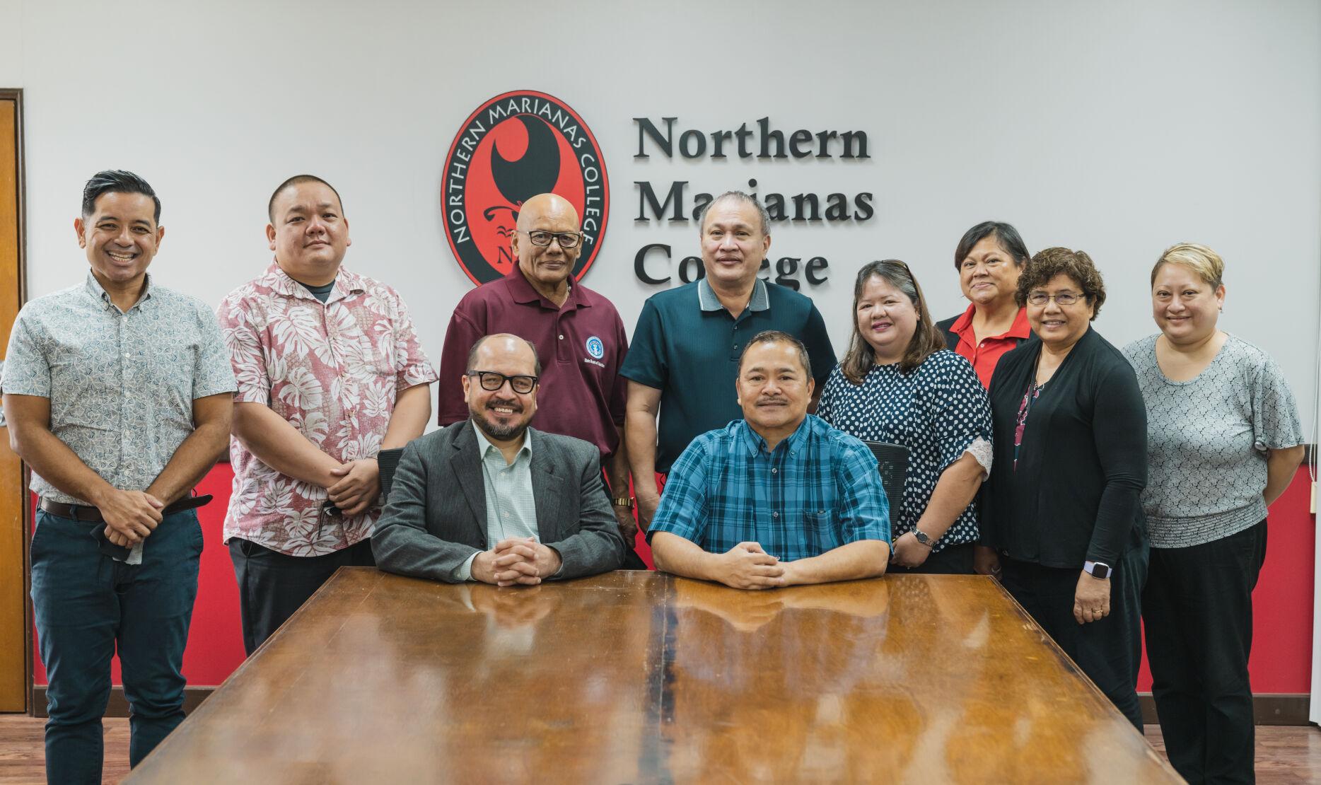 Northern Marianas College, Public School System and Board of Education officials pose for a photo following a meeting Thursday