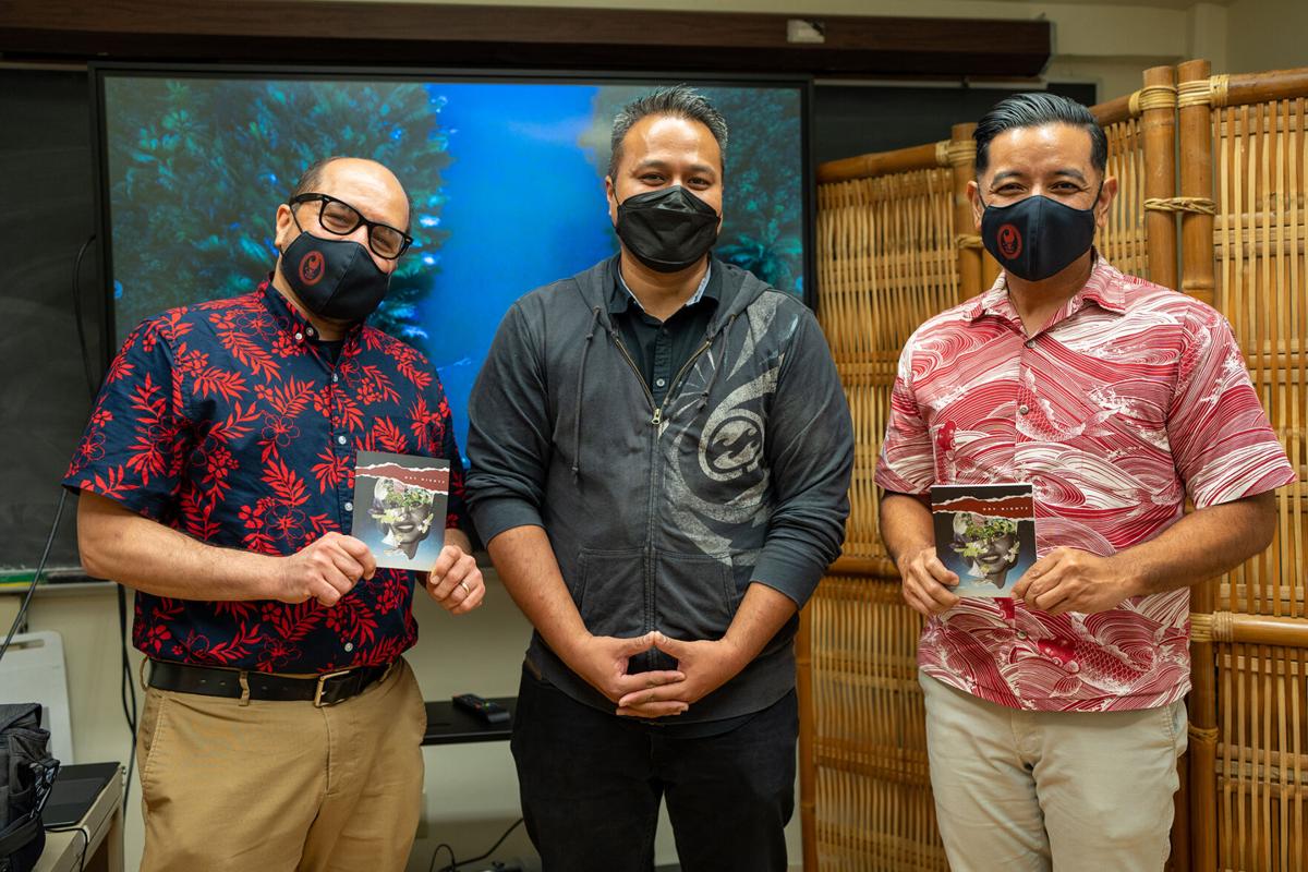 Northern Marianas College President Galvin Deleon Guerrero, left, and Vice President Frankie Eliptico, right, hold copies of the film "Dry Nights" with the film's director, Brian Muna, during a visit on Feb. 1 to UOG Press at the University of Guam. The film was co-directed by UOG Press Managing Editor Victoria-Lola Leon Guerrero and based on the UOG Press book "Dry Nights" by Guam author Pep Borja. Northern Marianas College now has its own imprint under UOG Press to begin publishing works specific to the Northern Mariana Islands and written by NMI authors. UOG photo