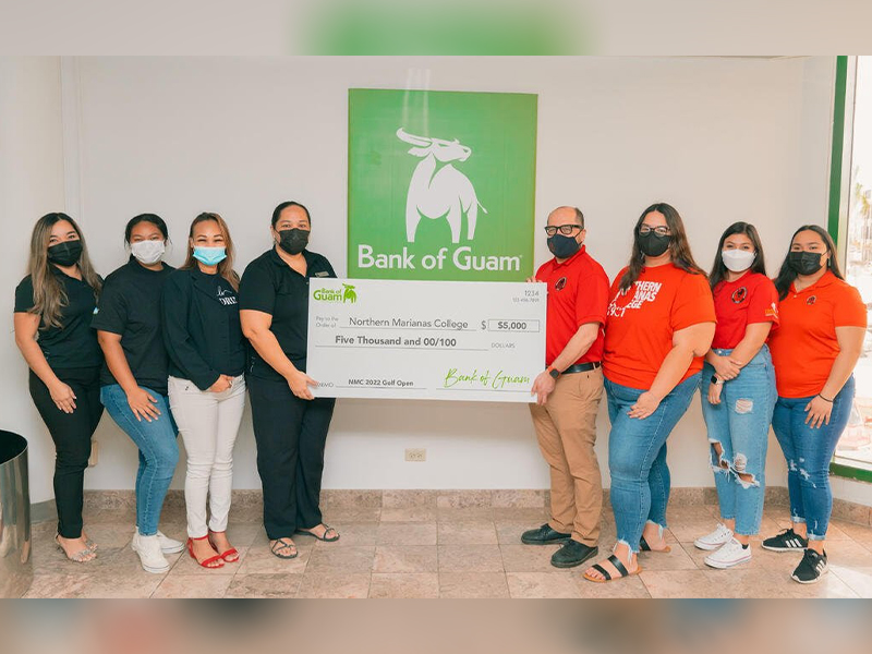 Bank of Guam recently donated $5,000 to the Northern Marianas College, in support of NMC's upcoming golf open on March 19, 2022 at the LaoLao Bay Golf and Resort. In photo is NMC President Galvin Deleon Guerrero, EdD, Bank of Guam Representative Charmaine Hofschneider and BOG Assistant Vice President/ Operations Manager Tania David, and NMC employees and students.