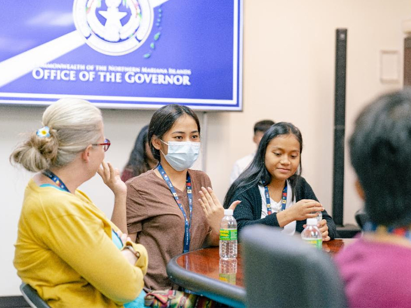 Gwyneth Danis (center), from Our Lady of Mercy Catholic High School in the Federated States of Micronesia, asks CNMI Gov. Ralph DLG Torres a question while on a visit at the Governor's Office.
