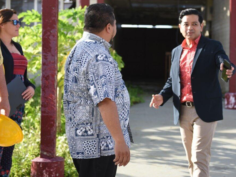 Frankie Eliptico, right, the interim president of Northern Marianas College, gives a tour of the buildings damaged by Super Typhoon Yutu  while Gov. Ralph DLG Torres and Federal Emergency Management Agency officials look on in late 2019.