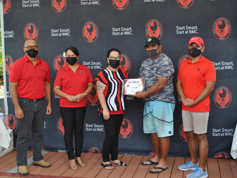 NMC Officials pose with Tony Benavente, 2nd right, who topped the seniors open division of the 16th Annual Golf Tournament.