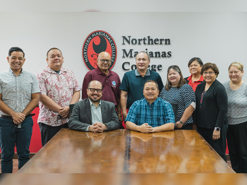 Northern Marianas College, Public School System and Board of Education officials pose for a photo following a meeting Thursday