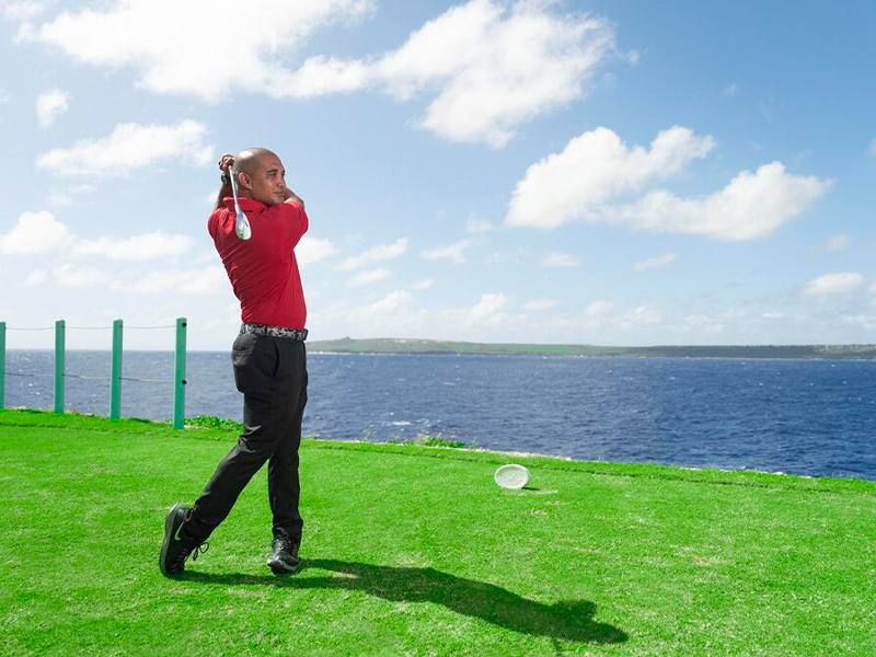 Man swinging a golf club