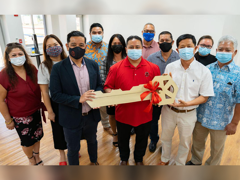 NMC Interim President Frankie Eliptico, third left, and Gov. Ralph DLG Torres, center, pose with NMC regents as they receive the ceremonial “key” from contractor principal Steve Qian of USA Fanter.