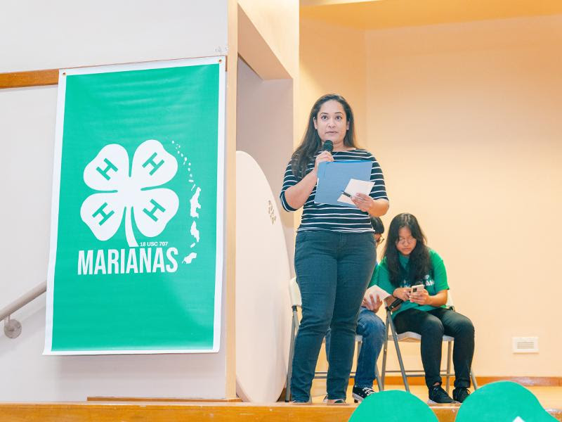 Natasha Nogis Tomokane speaks during the proclamation signing for National 4-H Week at the Kagman Community Center on Wednesday. 