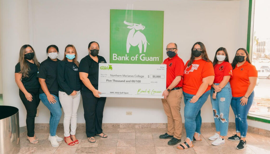 Bank of Guam recently donated $5,000 to the Northern Marianas College, in support of NMC's upcoming golf open on March 19, 2022 at the LaoLao Bay Golf and Resort. In photo is NMC President Galvin Deleon Guerrero, EdD, Bank of Guam Representative Charmaine Hofschneider and BOG Assistant Vice President/ Operations Manager Tania David, and NMC employees and students.